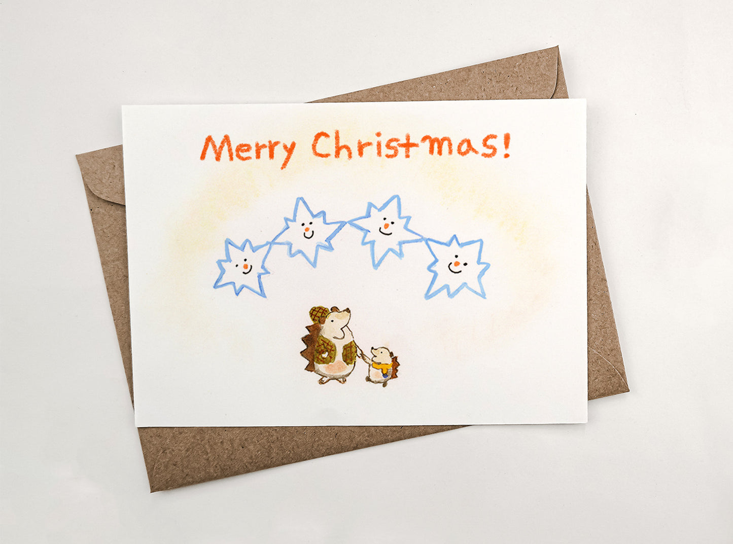 Christmas greeting card - Two Hedgehogs and the snowflakes