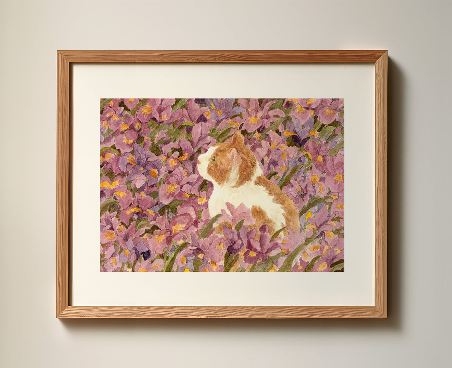 Ginger cat in violet iris garden